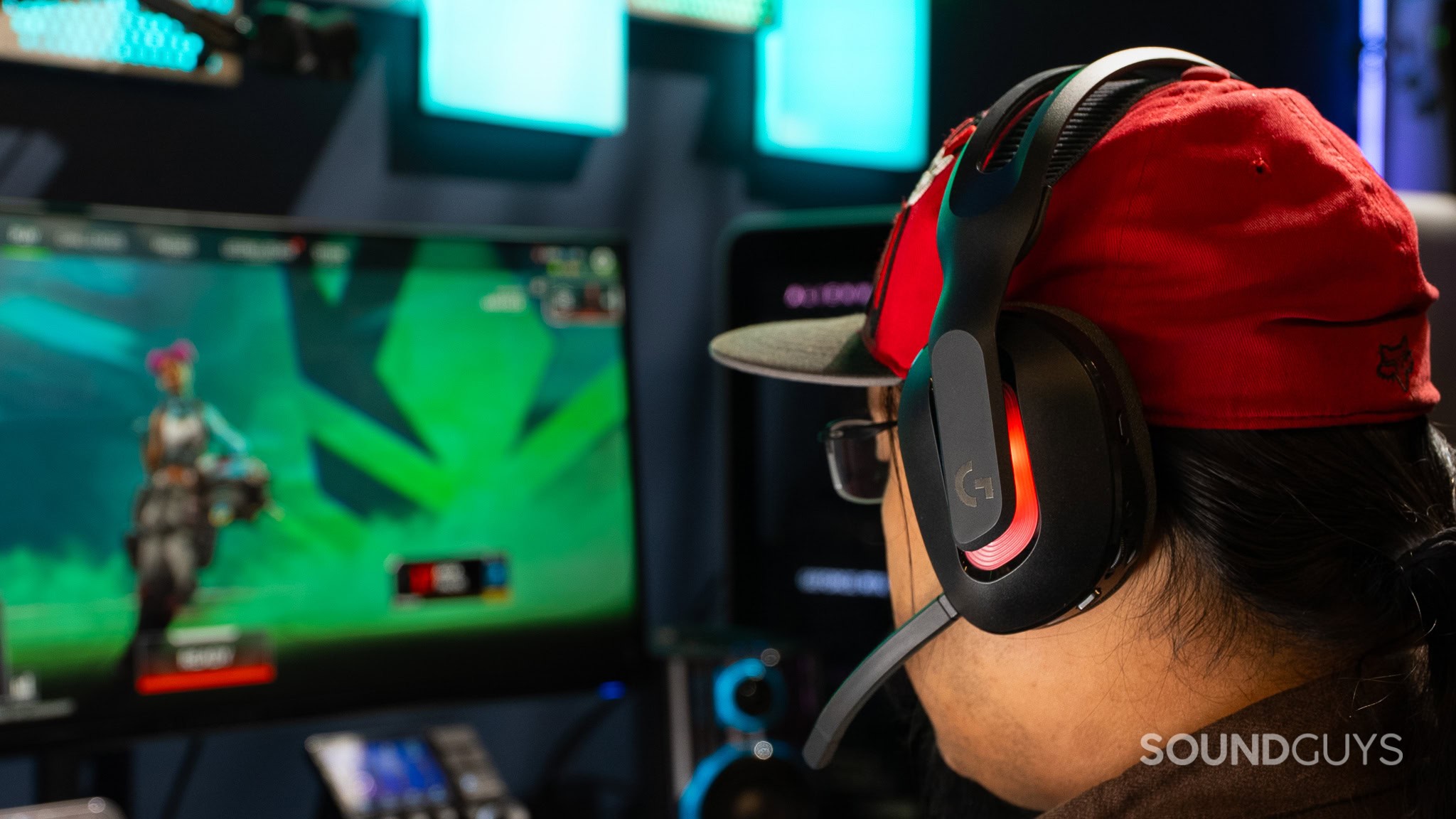 Logitech A20 X being worn by a person with a cap, playing a video game.