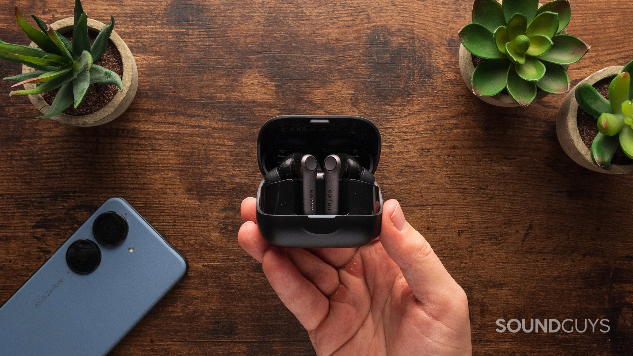 The EarFun Air Pro 4+ earbuds in their charging case.
