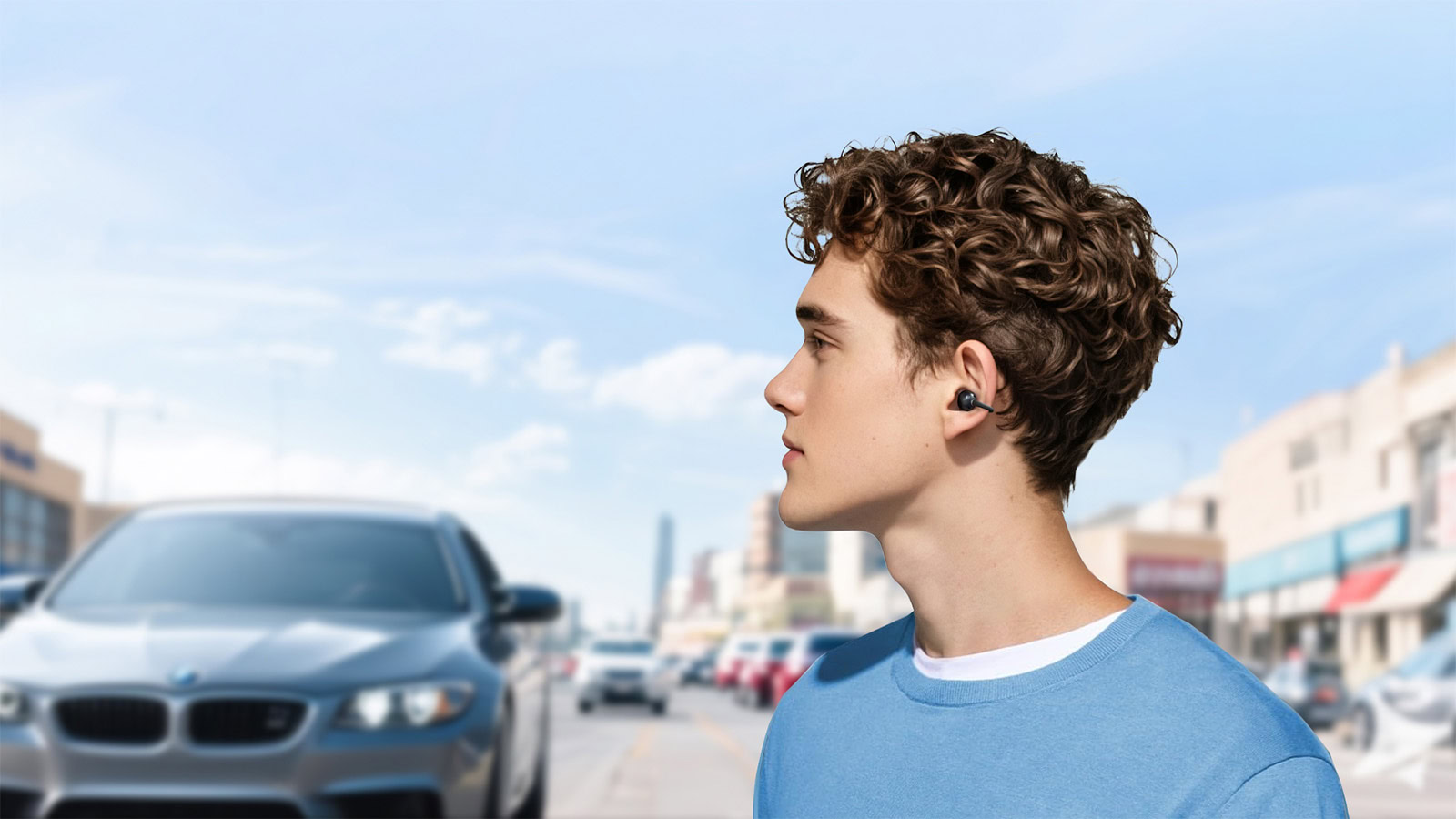 EarFun Clip earbuds worn by a man.